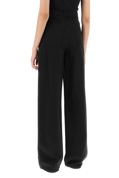 Shop The Row 'delton' Pants With Flared Leg In Black