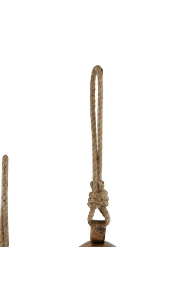 Ginger Birch Studio Bronze Metal Indoor Outdoor Meditation Decorative Cow Bell With Jute Hanging Rope In Bronze
