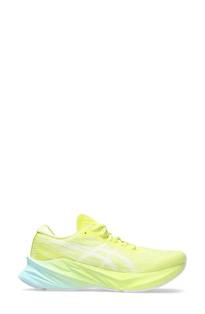 Shop Asics Novablast 3 Running Shoe In Glow Yellow/ White