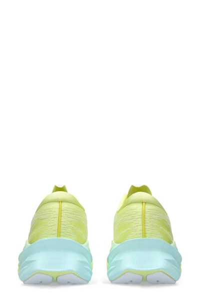 Shop Asics Novablast 3 Running Shoe In Glow Yellow/ White