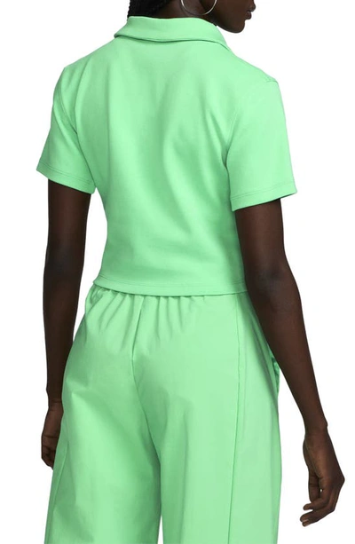 Shop Nike Essentials Stretch Crop Polo In Spring Green/ White