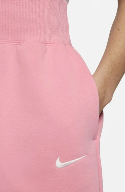 Shop Nike Sportswear Phoenix High Waist Fleece Sweatpants In Coral Chalk/ Sail