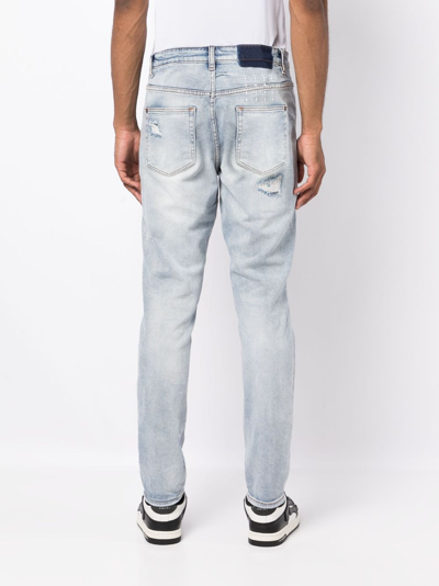 Shop Ksubi Wolfgang Distressed Tapered-leg Jeans In Blue