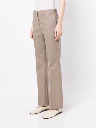 Shop The Row Flared Mélange Wool Trousers In Neutrals