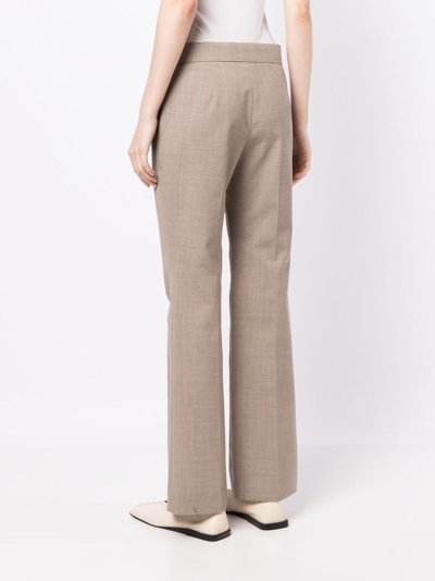 Shop The Row Flared Mélange Wool Trousers In Neutrals