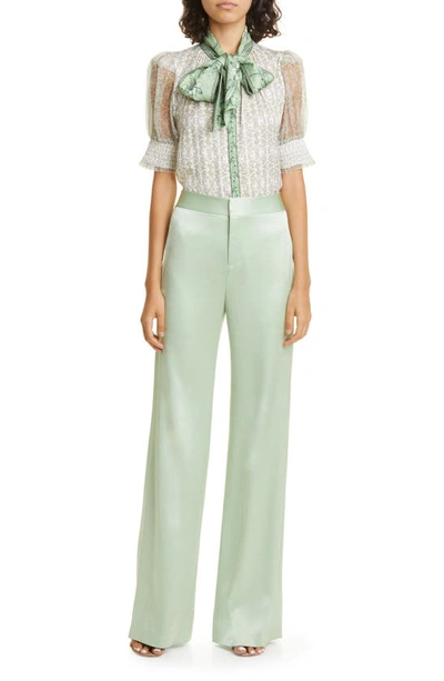Shop Alice And Olivia Deanna Stretch Cotton Satin Bootcut Pants In Green Tea