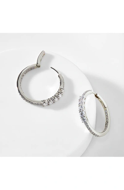 Shop Nadri Love All Cubic Zirconia Medium Hoop Inside Out Earrings In Rhodium