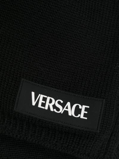 Versace Logo-appliqué Knitted Scarf In Black