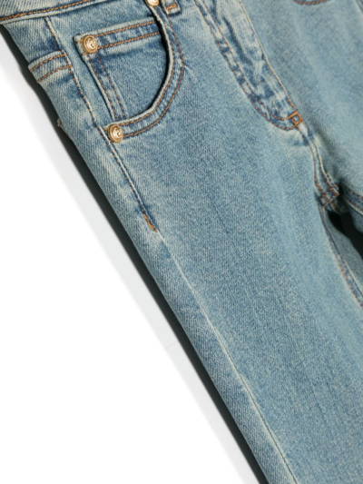 Shop Balmain Low-rise Flared Jeans In Blue