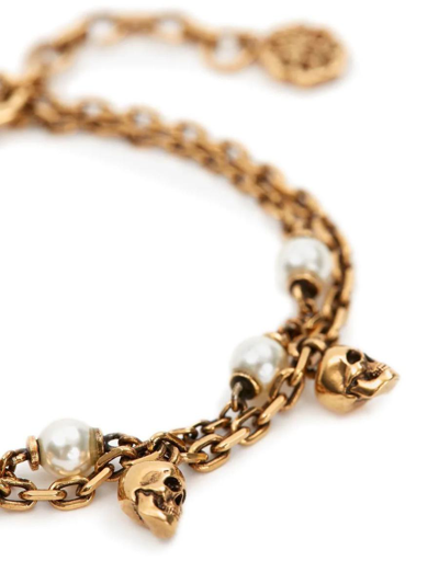 Shop Alexander Mcqueen Skull Pearl Chain Bracelet In Antiqued Gold In Golden