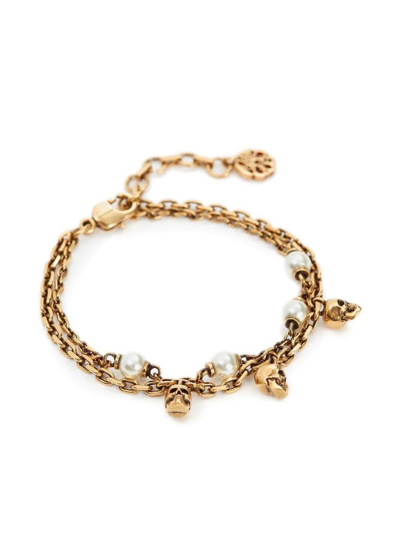 Shop Alexander Mcqueen Skull Pearl Chain Bracelet In Antiqued Gold In Golden