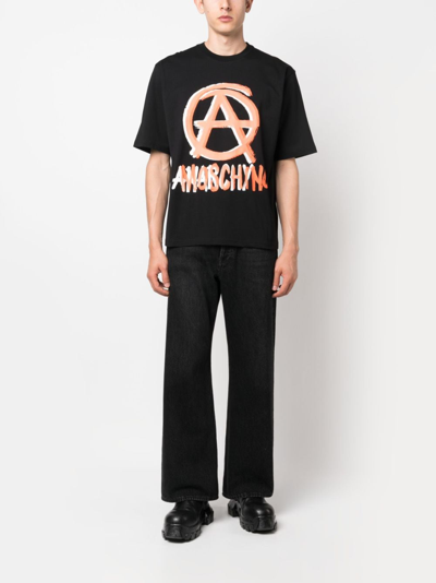 Shop Moschino Graphic-print Organic-cotton T-shirt In Black