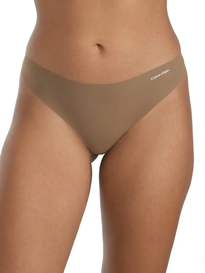 Shop Calvin Klein Invisibles Thong In Grey Olive