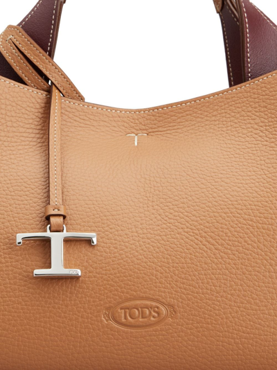 Shop Tod's Logo-pendant Leather Shoulder Bag In Brown