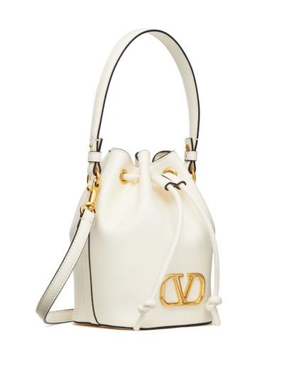 Shop Valentino Mini Vlogo Signature Leather Bucket Bag In White