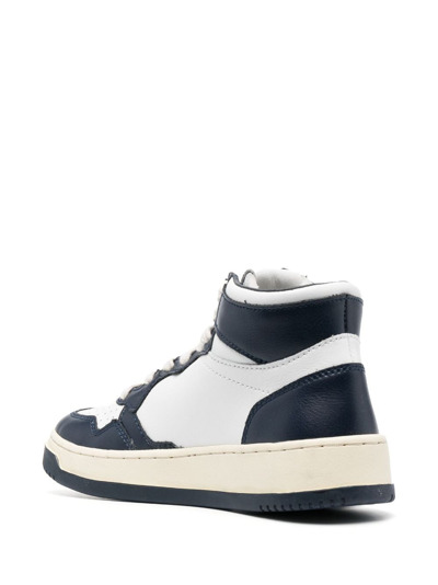 Shop Autry High-top Lace-up Sneakers In White