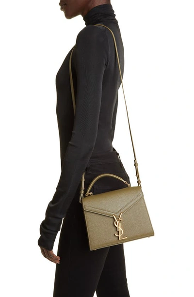 Shop Saint Laurent Mini Cassandra Leather Top Handle Bag In Vert Kaki
