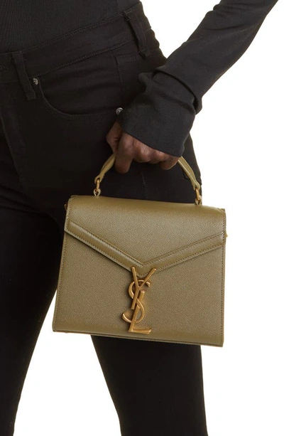 Shop Saint Laurent Mini Cassandra Leather Top Handle Bag In Vert Kaki