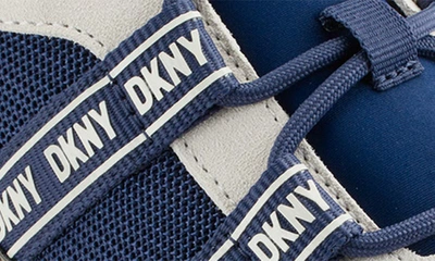 Shop Dkny Justine Sneaker In Ink Navy/ Pebble