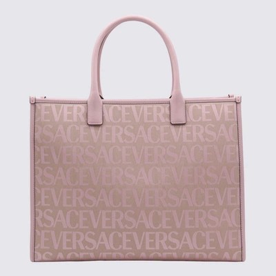 Shop Versace Pink Canvas And Leather Allover Tote Bag