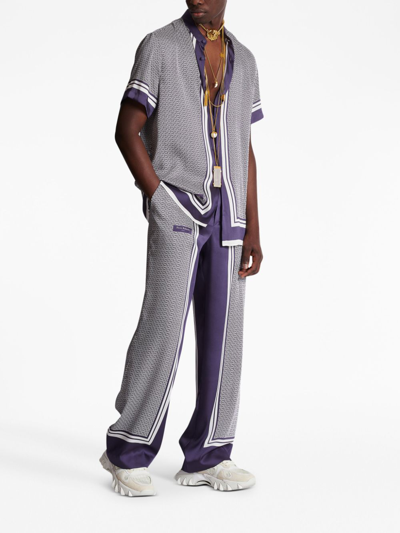 Shop Balmain Vertical-print Straight-leg Trousers In Purple