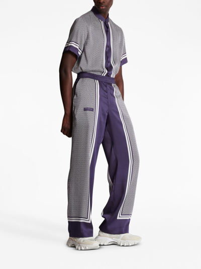 Shop Balmain Vertical-print Straight-leg Trousers In Purple