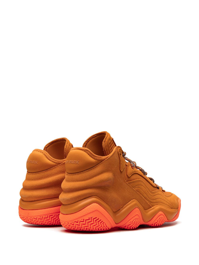 Shop Adidas Originals X Ivy Park Top Ten 2000 Sneakers In Orange