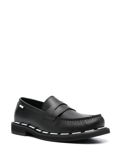 Shop Moschino Stitch-detailed Slip-on Loafers In Black