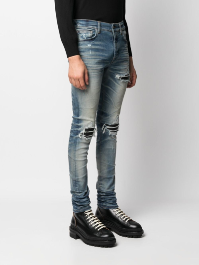 Shop Amiri Distressed Skinny Jeans In Blau