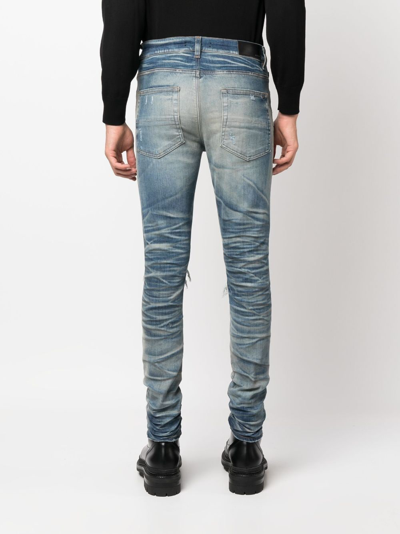 Amiri Distressed Skinny Jeans In Blau
