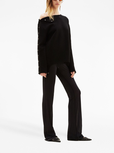 Shop Courrèges Logo-embroidered Flared Trousers In Black