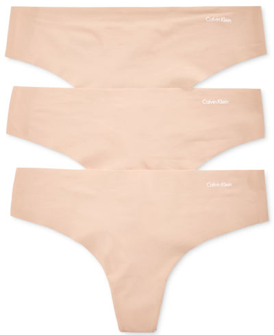 Shop Calvin Klein Women's Invisibles 3-pack Thong Underwear Qd3558 In Tan/beige