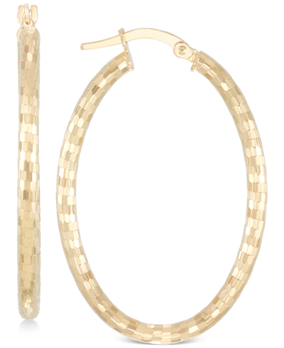 Shop Italian Gold Oval Textured Hoop Earrings In 14k Gold In Yellow