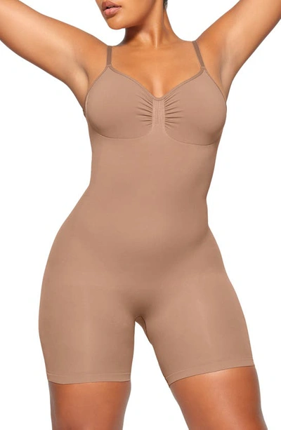 Shop Skims Seamless Sculpt Low Back Mid Thigh Bodysuit In Sienna