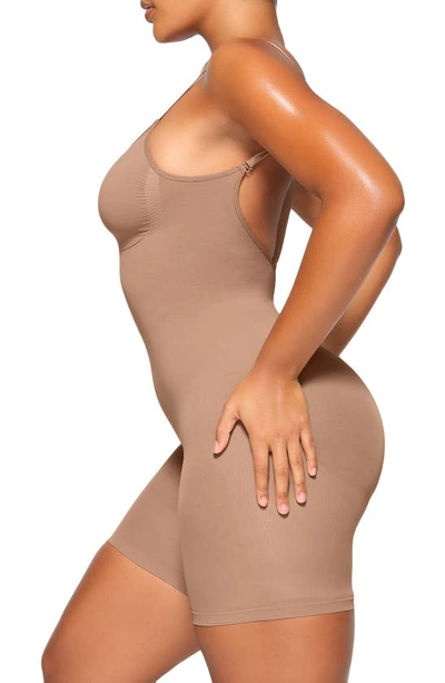 Shop Skims Seamless Sculpt Low Back Mid Thigh Bodysuit In Sienna