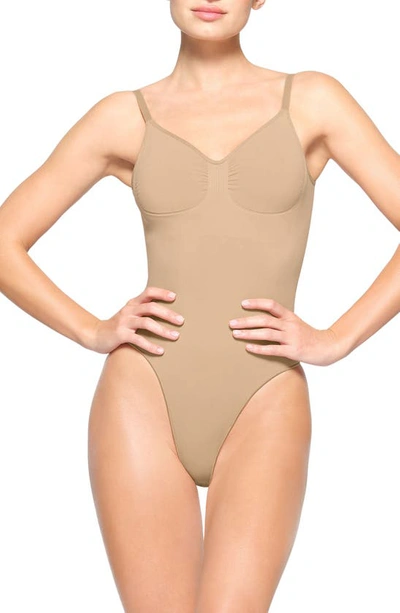 Skims Seamless Sculpt Low Back Thong Bodysuit In Clay