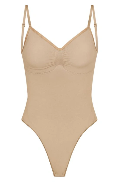 Skims Beige Seamless Sculpt Deep Plunge Thong Bodysuit In Clay