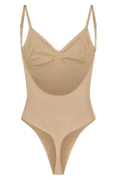 Skims Beige Seamless Sculpt Deep Plunge Thong Bodysuit In Clay