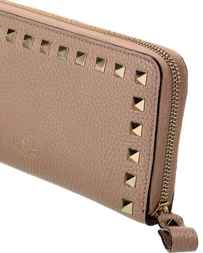 Shop Valentino Rockstud Grainy Leather Zip Around Wallet In Pink