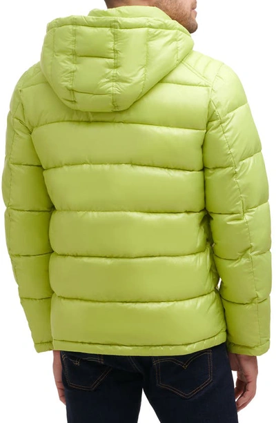 Shop Guess Hooded Solid Puffer Jacket In Limeade