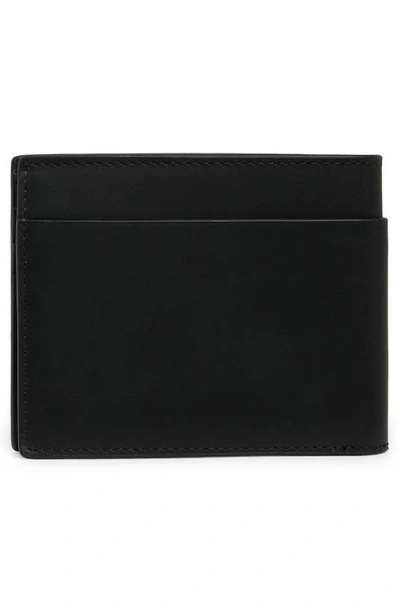 Shop Cole Haan Diamond Slim Bifold Wallet In Black