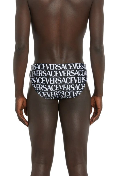 Shop Versace Logo Swim Briefs In 5b040-black White