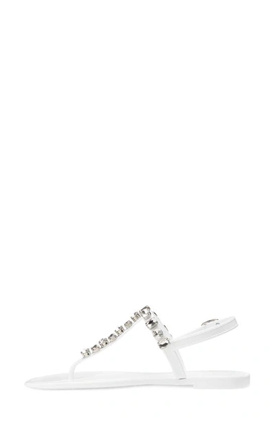 Shop Stuart Weitzman Jaide Embellished Jelly T-strap Sandal In White/ Clear