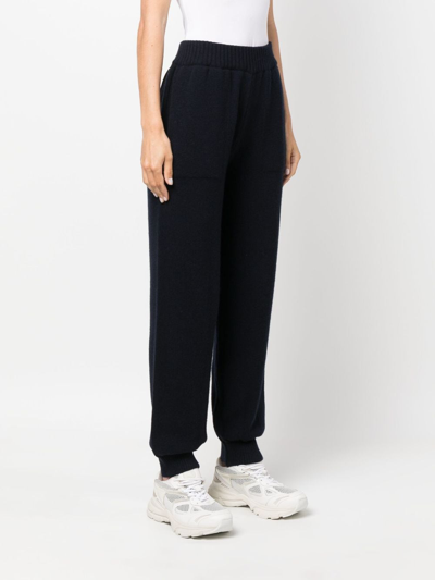 Shop Msgm Logo-embroidered Knitted Trousers In Blue