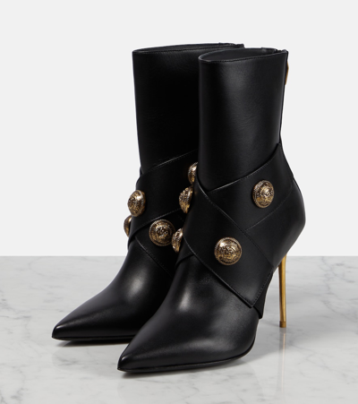 Balmain Black Ankle Boots Embellished With Gold Embossed Buttons In Black