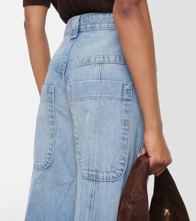 Shop Khaite Jackie Low-rise Wide-leg Jeans In Blue