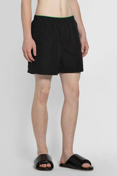 Shop Bottega Veneta Man Black Swimwear