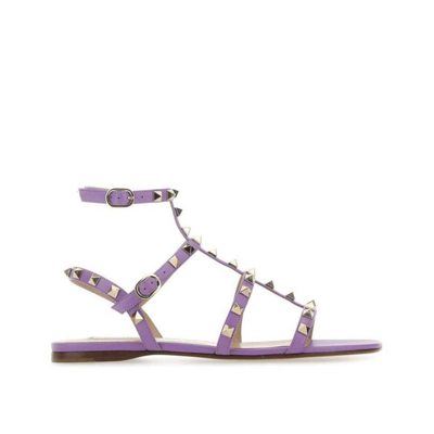 Shop Valentino Rockstud Leather Sandals In Purple