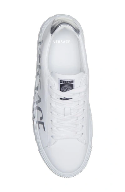 Shop Versace La Greca Logo Low Top Sneaker In White Silver
