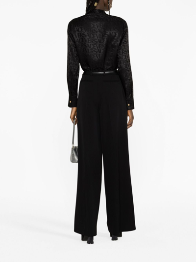 Versace Allover Logo Patterned Satin Shirt In Black